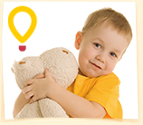 Child holding stuffed animal
