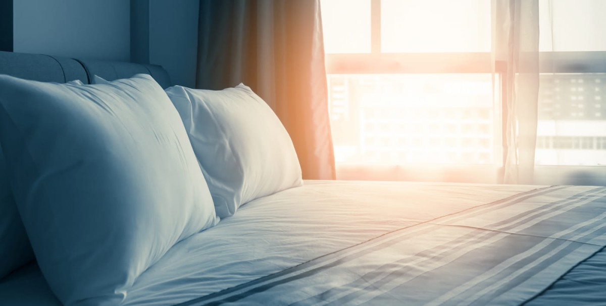 A large comfortable bed with large pillows