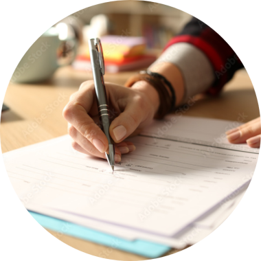 A person filling out paperwork