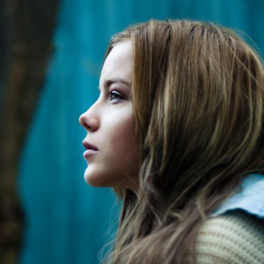 A young pensive woman outdoors